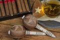 Cigars and Rum or alcohol on table Royalty Free Stock Photo