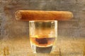 Cigars and whisky on old wooden table. Royalty Free Stock Photo