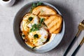 Cilbir or Turkish Eggs. dish served as mezze: poached eggs topped over herbed greek yogurt, then drizzled with hot