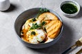 Cilbir or Turkish Eggs. poached eggs topped over herbed greek yogurt, drizzled with hot spiced paprika olive oil