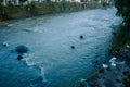 The Ciliwung River, colored brown, flowing under the bright morning sun Royalty Free Stock Photo