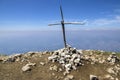 Cima delle Pozzette, wooden cross on the top of a mountain, touristic trail Alta Via del Monte Baldo