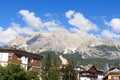 Cima Tofana mountain panorama view with houses in Cortina d`Ampezzo, Italy Royalty Free Stock Photo
