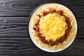 Cincinnati style chili 5 way close up on the black wooden background. Horizontal top view Royalty Free Stock Photo