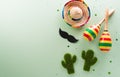 Cinco de Mayo holiday background made from maracas, mexican blanket stripes or poncho serape, cactus and hat on pastel background Royalty Free Stock Photo