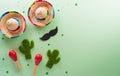 Cinco de Mayo holiday background made from maracas, mexican blanket stripes or poncho serape, cactus and hat on pastel background Royalty Free Stock Photo