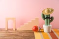 Cinco de Mayo holiday background with Mexican cactus,  party sombrero hat and maracas on wooden table Royalty Free Stock Photo