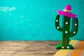 Cinco de Mayo holiday background with Mexican cactus and party sombrero hat