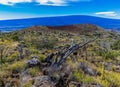 Cinder Cone and Volcanic Landscape of Mauna Kea With The Summit of Mauna Loa Royalty Free Stock Photo