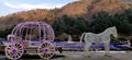 A cinderella pumpkin horse cart fitted with fairy lights