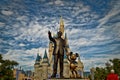 Cinderella`s castle in Magic kingdom with Walt Disney and Mickey statue