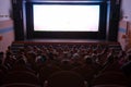 Cinema auditorium with people Royalty Free Stock Photo