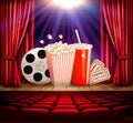 Cinema background with a film reel, popcorn Royalty Free Stock Photo