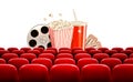 Cinema background with a film reel, popcorn, drink and tickets.