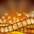 Cinema background with film strips and light rays Royalty Free Stock Photo