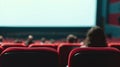 Cinema blank screen and people in red chairs in the cinema hall. Generative Ai