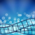 Cinema blue background with film strips and light rays Royalty Free Stock Photo