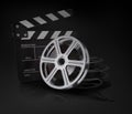 Cinema clap and film reel. Royalty Free Stock Photo