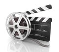 Cinema clap and film reel . Royalty Free Stock Photo