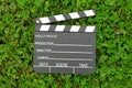 Cinema clapper board on green grass Royalty Free Stock Photo