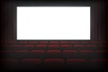 Cinema dark hall with white empty screen Royalty Free Stock Photo