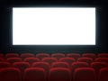 Cinema hall with white blank screen and chairs Royalty Free Stock Photo