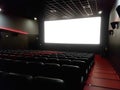 Cinema interior of movie theatre with empty red and black seats Royalty Free Stock Photo