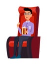 Cinema. Man sitting in chair at movie theater auditorium with pop corn box. Young male watching film or motion picture