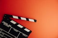 Cinema minimal concept. Watching film in the cinema. clapper board on red background. Royalty Free Stock Photo