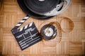 Cinema movie clapper board and film reel Royalty Free Stock Photo
