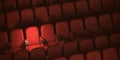 Cinema movie theater concept background. Red cinema seats and cola in empty theater