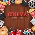 Cinema movie theater poster template. Film reel, popcorn, clapper, 3D glasses. Concept banner on wooden background