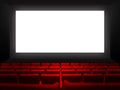 Cinema movie theatre with red seats and a blank white screen Royalty Free Stock Photo