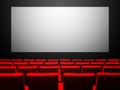 Cinema movie theatre with red seats and a blank white screen Royalty Free Stock Photo