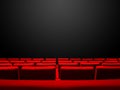 Cinema movie theatre with red seats rows and a black background Royalty Free Stock Photo