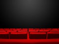 Cinema movie theatre with red seats rows and a black background Royalty Free Stock Photo