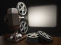 Cinema, movie or video concept. Vintage projector with projecting blank and reels of film. Royalty Free Stock Photo