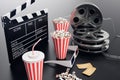 Cinema movie watching. Composition with 3d glasses, movie clapper, film reel, popcorn and filmstrip Cinema concept Royalty Free Stock Photo