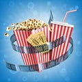 Cinema popcorn, soda drink, tickets and film strip Royalty Free Stock Photo