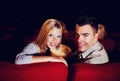 Cinema, portrait and couple with popcorn on date, watching film or video on romantic night together. Movies, man and Royalty Free Stock Photo