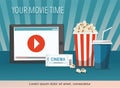 Cinema poster with tablet, popcorn bowl, drink and tickets isolated on blue background Royalty Free Stock Photo