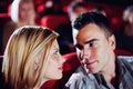 Cinema, romance and couple watching film, love and romantic date together. Movie night, man and woman in theater with Royalty Free Stock Photo