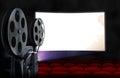 Cinema screen with empty seats and projector Royalty Free Stock Photo