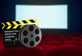 Cinema seat with clapperboard and film reel