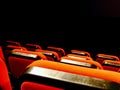 Cinema seats, bioscoop chairs in the dark. Movie theater in darkness.