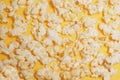 Cinema session, film, popcorn, 3D glasses. View movie concept, discounts. Background of yellow popcorn. Close-up popcorn on a