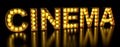 Cinema signboard from golden light bulb letters, retro glowing font. 3D rendering