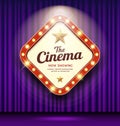 Cinema Theater sign shaped square light up on purple curtain design background Royalty Free Stock Photo