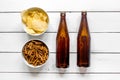 Cinema and TV whatching with beer, crumbs, chips white wooden background top view