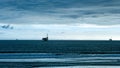 Cinemagraph of view of the ocean with industrial oil plattforms